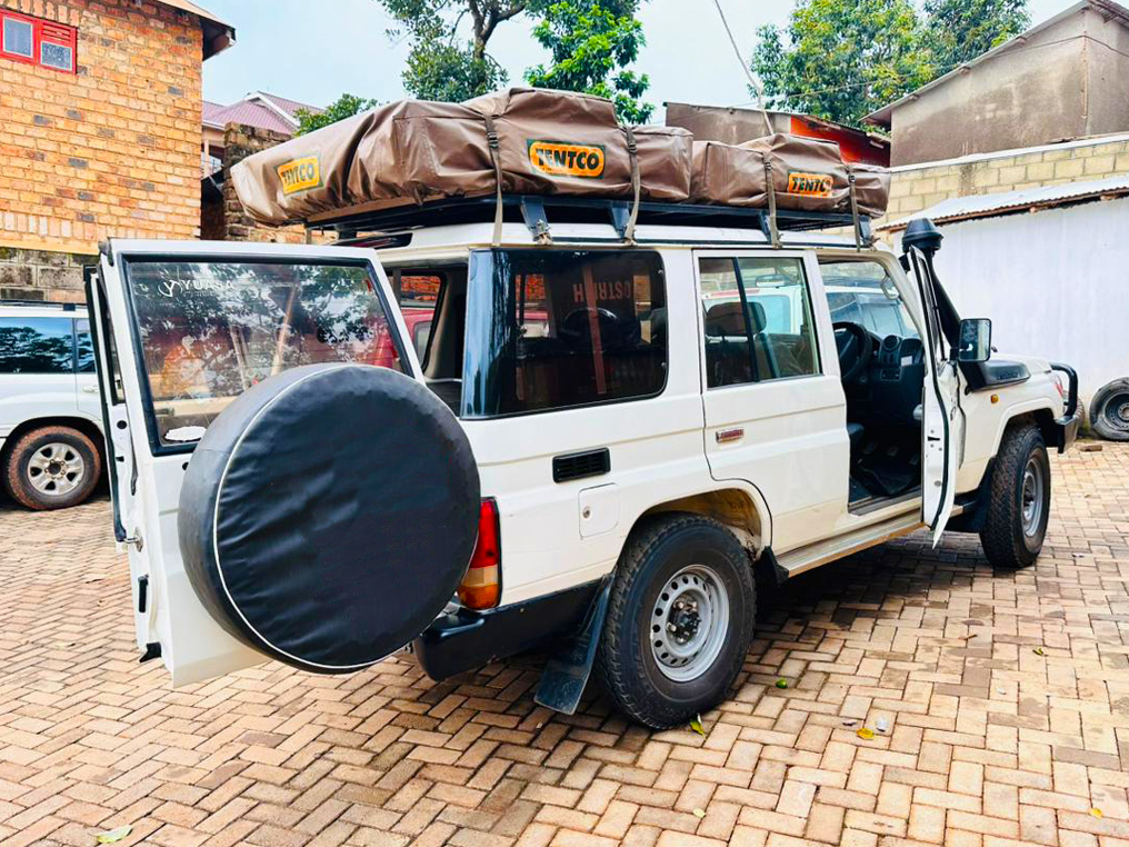 Frequently Asked Questions – Camper Cruiser Hire Uganda 1. What is a Camper Cruiser in Uganda? A Camper Cruiser in Uganda is a fully equipped 4×4 Land Cruiser designed for camping safaris and overland travel. It combines transport and accommodation in one vehicle, allowing travelers to explore remote areas while carrying their camping setup. 2. How many people can travel in a Camper Cruiser? A Camper Cruiser can comfortably carry up to five passengers. The rooftop tent typically sleeps two adults, while additional camping arrangements can be organized depending on group needs. 3. Is Camper Cruiser Hire Uganda suitable for self-drive safaris? Yes. Camper Cruiser Hire Uganda is ideal for self-drive safaris. The vehicle is easy to handle, highly reliable, and built for Uganda’s road conditions, including national parks and rural routes. 4. What camping equipment is included with the Camper Cruiser? Each Camper Cruiser comes fully equipped with a rooftop tent, foam mattress, sleeping bags, pillows, bed linen, gas cooker, cooking utensils, plates, cups, camping table, and chairs. This allows travelers to be completely self-sufficient. 5. Can the Camper Cruiser handle off-road and park roads? Yes. The Camper Cruiser is built on a rugged Land Cruiser platform with 4×4 capability, high ground clearance, and strong suspension, making it suitable for rough terrain, gravel roads, and safari park tracks. 6. Is Camper Cruiser Hire Uganda available with a driver? Yes. Camper Cruiser Hire Uganda can be arranged with a professional safari driver or on a self-drive basis. Experienced drivers are available for travelers who prefer guided travel and local expertise. 7. Do I need special driving skills to use a Camper Cruiser? Basic 4×4 driving knowledge is helpful but not mandatory. Before departure, a full vehicle briefing is provided, and safety guidance is given to ensure confident and responsible driving. 8. Where can I take a Camper Cruiser in Uganda? The Camper Cruiser can be used across Uganda, including national parks, wildlife reserves, camping sites, and remote countryside areas. It is ideal for destinations such as Murchison Falls, Queen Elizabeth, Kidepo Valley, and Lake Mburo. 9. Is Camper Cruiser Hire Uganda affordable? Yes. Camper Cruiser Hire Uganda is cost-effective because it combines transport and accommodation in one vehicle. It helps reduce lodge costs and offers excellent value for long-distance and extended safari trips. 10. Is the Camper Cruiser safe for camping in wildlife areas? Yes. Rooftop tents provide elevated sleeping, keeping travelers safe from ground animals. Camping is done in designated or recommended areas, and safety guidelines are always provided. 11. Who should consider hiring a Camper Cruiser in Uganda? This vehicle is ideal for adventure travelers, self-drive safari enthusiasts, photographers, filmmakers, researchers, and travelers seeking flexible and remote travel experiences.